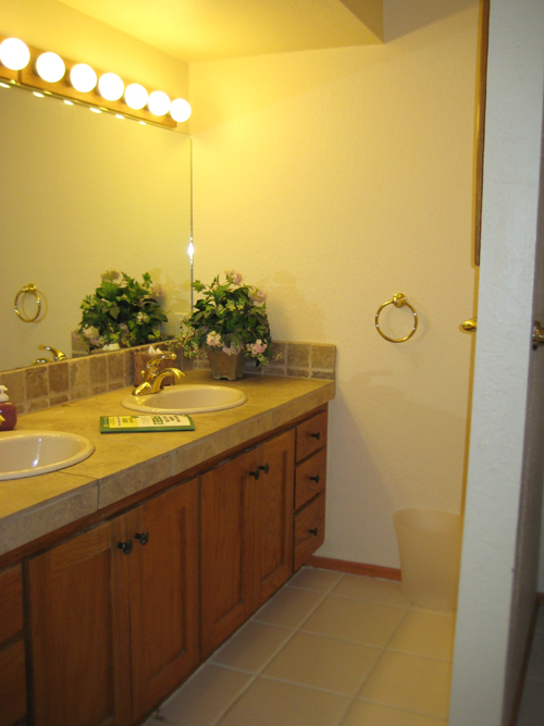 The before image show two sinks with a continuous base cabinet below